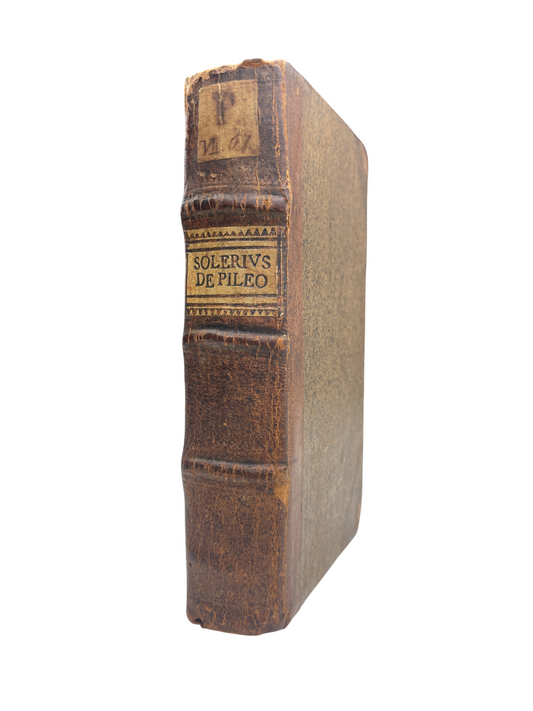 First edition 1672 Anselmus Solerius Cemeliensis Pileo Theophile Raynaud Jesuit hat treatise headgear caps crowns bishop mitres cardinal hats Jewish rabbinical caps female headdresses early modern Europe Romeyn de Hooghe engraved title-page engravings material culture pseudonymous publication rare antique book 17th century historical fashion ceremonial headwear Jesuit scholarship rare illustrated book early modern costume study